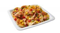 Caribbean Chicken Nachos with TOSTITOS® Whole Grain Rich Crispy Round Tortilla Chips
