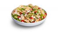 Chicken Caesar Salad with TOSTITOS® Whole Grain Crispy Rounds Tortilla Chips