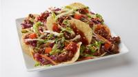 Sriracha BBQ Beef Nachos with TOSTITOS® Whole Grain Rich Crispy Round Tortilla Chips.jpg